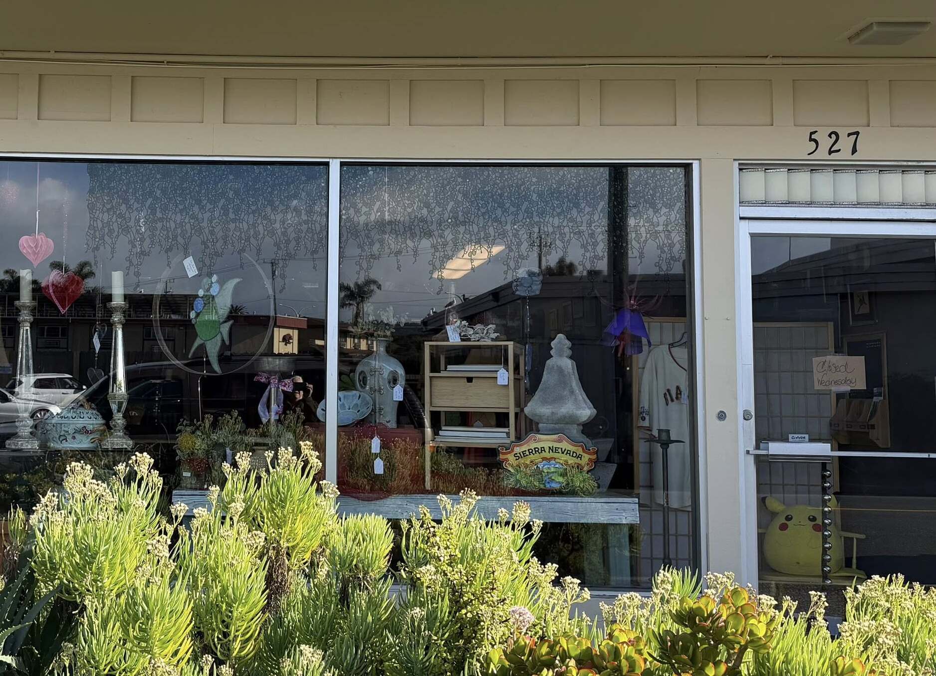 LilyLou's Vintage Market storefront on Ramona Avenue in Monterey, with purple striped awnings and curated vintage displays out front